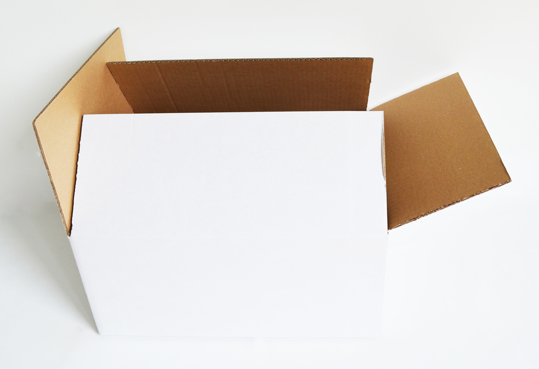 Practical cardboard box in medium size for storing, transporting or shipping various objects