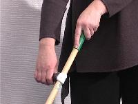 You hold the sweeper with your left hand and the T-grip with your right hand.