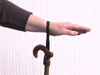 Place the strap on your wrist, so that you can let go of your walking cane when pleased, while the walking cane will stay attached to your wrist.