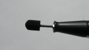 Grinding mandrel made of rubber for covering a small sandpaper cap