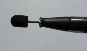 Grinding mandrel made of rubber for covering a medium sandpaper cap